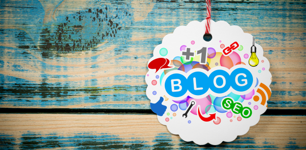 White Tag with the Blog & SEO Written on it against a blue wooden background. 